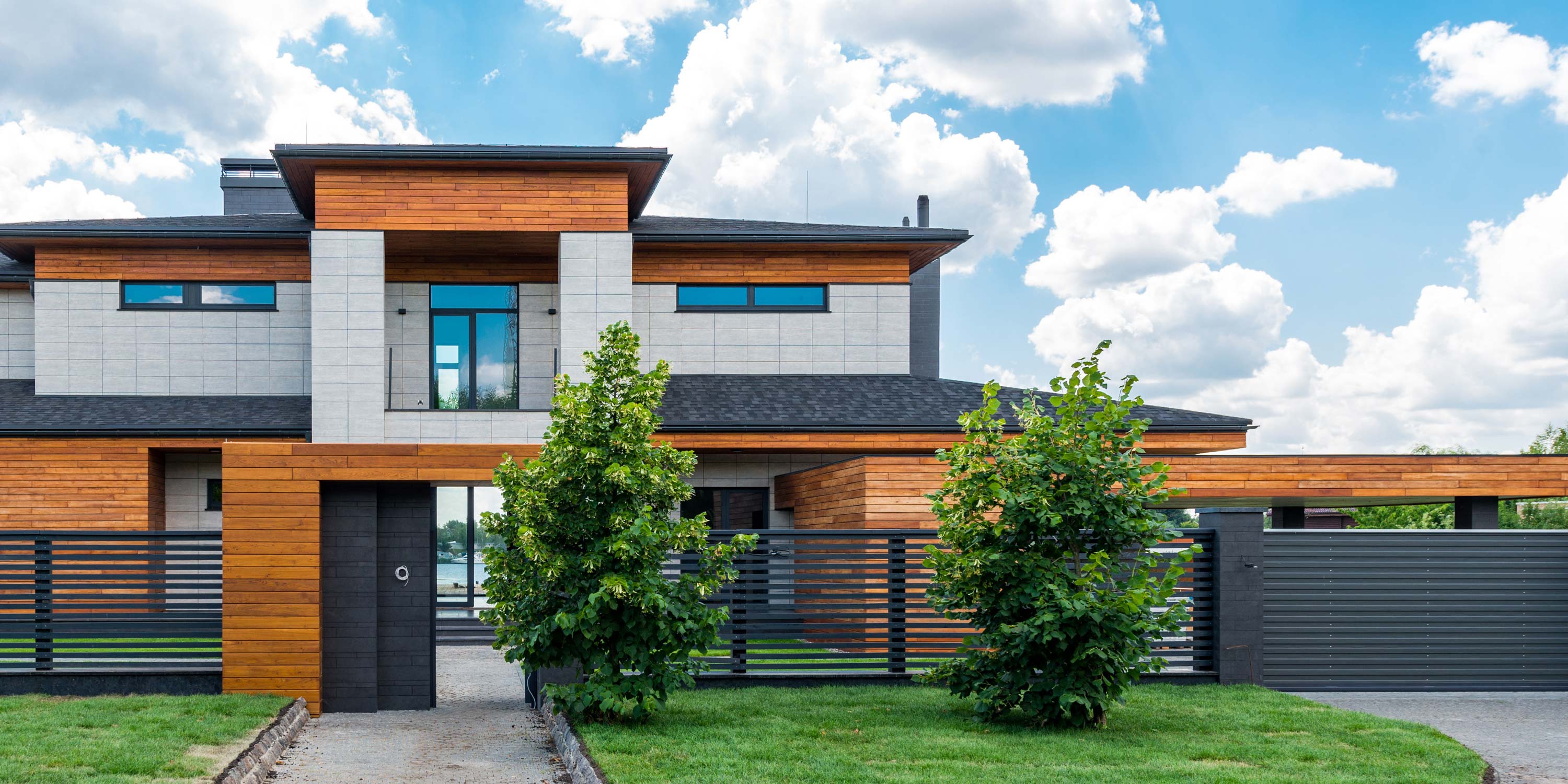 modern home with cloudy sky