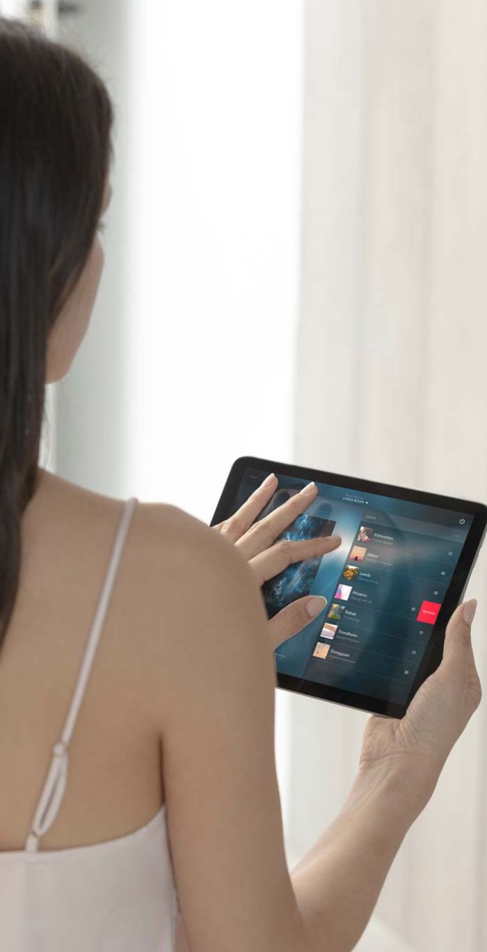 woman looking over a cityscape carrying coffee