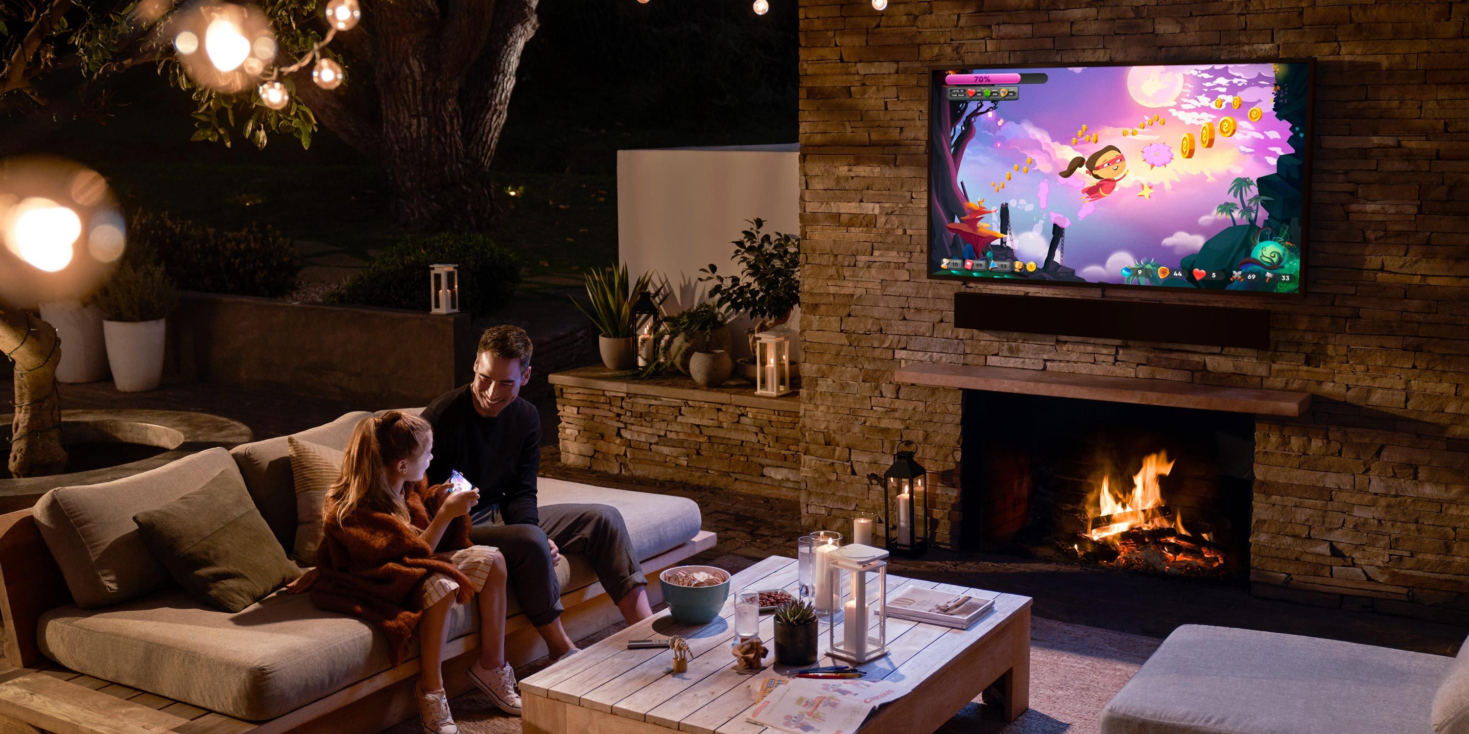outdoor patio with samsung technology and a dad and daughter spending time together